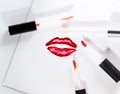 Voluminous sparkling painted lips and a lot of lip gloss brushes. Royalty Free Stock Photo