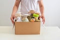 Volunteer with box of food for poor. Donation concept. Royalty Free Stock Photo