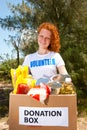 Volunteer carrying food donation box Royalty Free Stock Photo