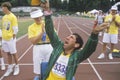 Volunteer cheering with handicapped athlete