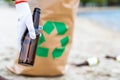 Volunteer cleaning beach from trash Royalty Free Stock Photo