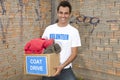 Volunteer with coat drive donation box Royalty Free Stock Photo