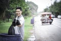 Volunteer collecting trash garbage, man holding and dumping garbage bag, clean up area of dirty, environmental charity concept Royalty Free Stock Photo