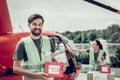 Volunteer feeling cheerful sending first aid boxes with colleague