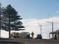 Volunteer firefighters and police on street with fire truck and police vehicle Royalty Free Stock Photo