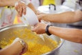 Volunteer food servers dish out a free charity : concept of helping Royalty Free Stock Photo