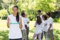 Volunteer gesturing thumbs up at park