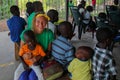 Volunteer girl in Africa with small children