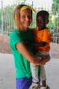Volunteer girl in Africa with small children