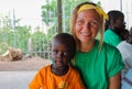 Volunteer girl in Africa with small children