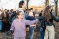 Volunteer girl releases a bat, raising her hand up