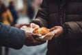 Volunteer hands giving to poor old homeless man food. Donation, charity, sharing, help and hope concept Royalty Free Stock Photo