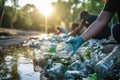 Volunteer help collect trash into black garbage bags at various locations on the occasion of World Environment Day.by