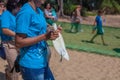 Volunteer holding a young turtle Royalty Free Stock Photo