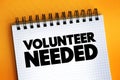 Volunteer Needed text on notepad, concept background Royalty Free Stock Photo