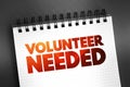 Volunteer Needed text on notepad, concept background Royalty Free Stock Photo