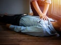 Volunteer office woman use hand pump on chest for first aid emergency CPR on heart attack man unconscious, try to resuscitation