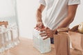 Volunteer opening pack of water bottles