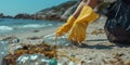 Volunteer picking up plastic trash on beach. AI generated Royalty Free Stock Photo