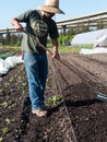 Volunteer preparing soil at community farm