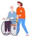 Volunteer pushing senior in wheelchair. Woman helping disabled person Royalty Free Stock Photo