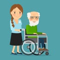 Volunteer pushing wheelchair with disabled old man Royalty Free Stock Photo