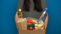 Volunteer putting food in a donation box Royalty Free Stock Photo