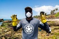 Volunteer shows oil removed from Rio Vermelho beach after spillage by a ship off the Brazilian coast