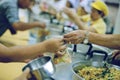 Volunteer to Feed the Hungry in Society: The Concept of Donating Food to the Poor in Society Royalty Free Stock Photo