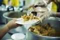 Volunteer to Feed the Hungry in Society: The Concept of Donating Food to the Poor in Society Royalty Free Stock Photo