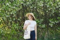 Volunteer woman is cleansed in the spring forest. Earth day and environmental improvement concept.