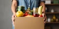 Volunteer Woman Collecting Groceries in Donation Box. Generative ai