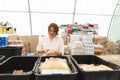 Volunteer woman preparing donation boxes for people.