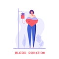 Volunteer woman standing with heart and donating blood. Donor. Concept of donation, world blood donor day, blood bank, health care