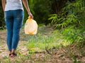 Volunteer women carry plastic bags in plastic bottles collected in public parks Royalty Free Stock Photo