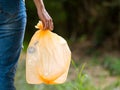 Volunteer women carry plastic bags in plastic bottles collected in public parks Royalty Free Stock Photo