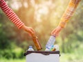 Volunteer women collect plastic water bottles in the park area, From people who refuse to throw in the trash into paper box for