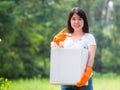 Volunteer women collect plastic water bottles in the park area Royalty Free Stock Photo