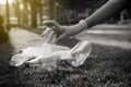 Volunteer woman hands keep plastic bottle on green grass,Good conscious mind,Dispose recycle and waste management concept,Black an