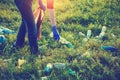 Volunteer young woman collecting garbage, holding full bag of waste and plastic bag Royalty Free Stock Photo