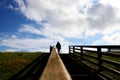 Volunteering on a farm - silhouette of a girl holding pitchfork