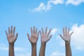 volunteering concept. Hands of people with blue sky on background