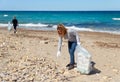 Volunteers cleaning beach area from plastic Royalty Free Stock Photo