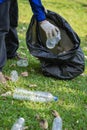 Volunteers collect plastic bottles in garbage bags ecology natural pollution garbage care charity volunteer community environment Royalty Free Stock Photo