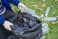 Volunteers collect plastic bottles in garbage bags ecology natural pollution garbage care charity volunteer community environment Royalty Free Stock Photo