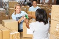 Volunteers Collecting Food Donations In Warehouse