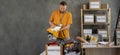 Volunteers collecting food donations in warehouse. volunteer man holding donations boxes in a warehouse, putting clothes