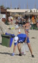 Volunteers during environmental cleaning on the beach in mallorca detail