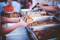 Volunteers give food to the poor: concept of charity food for the poor Royalty Free Stock Photo