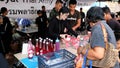 Volunteers giving free drinks to mourners at The Grand Palace in Bangkok